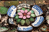 Bangkok Wat Arun - polychromatic mosaic flowers made from discarded ceramic pottery cut into petal shape. 